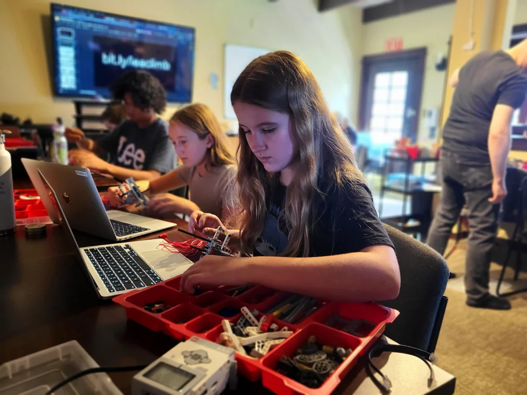 Academy students building machines at IEA Learning Center